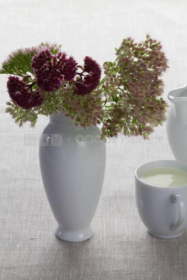 A cup of milk and autumn flowers